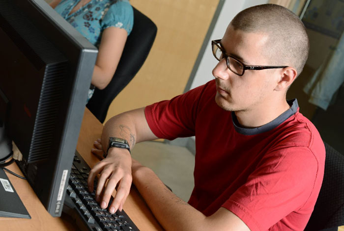 Adult student at a computer